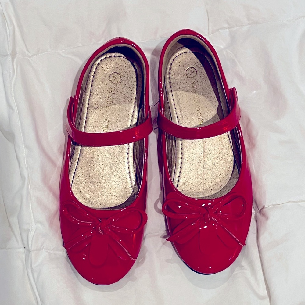 Red Mary Jane flats with bows